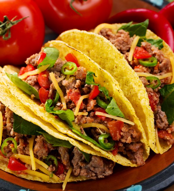 plate of tacos on wooden table