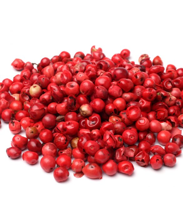 Pink pepper on white background