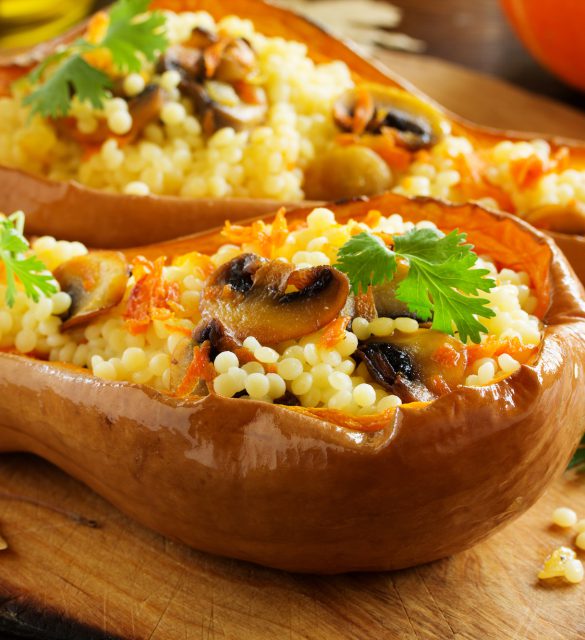 Pumpkin stuffed with couscous with grilled mushrooms.
