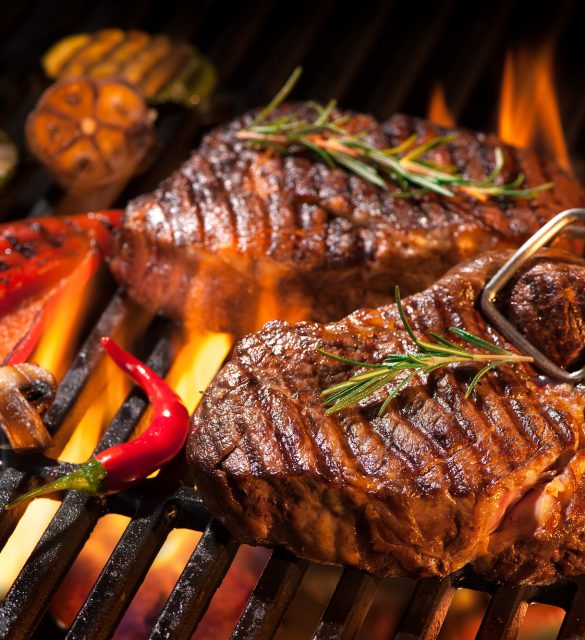 Beef steaks on the grill Beef steaks on the grill with flames