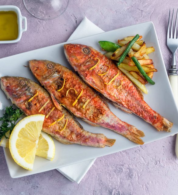 Fried Red Mullet or Turkish Barbunya on Plate, top view Fried Red Mullet or Turkish Barbunya on Plate, top view.