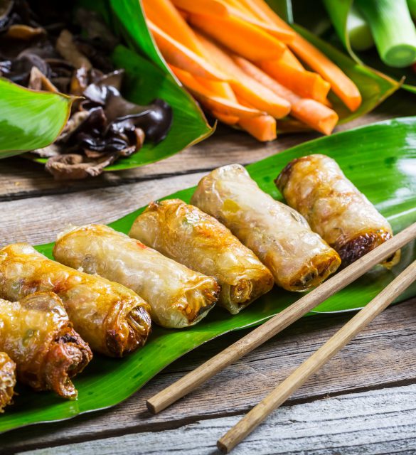 Fried spring rolls surrounded by ingredients Fried spring rolls surrounded by ingredients