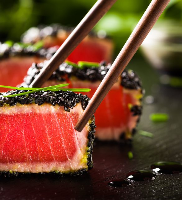 Fried tuna steak in black sesame with chopsticks Fried tuna steak in black sesame with chopsticks