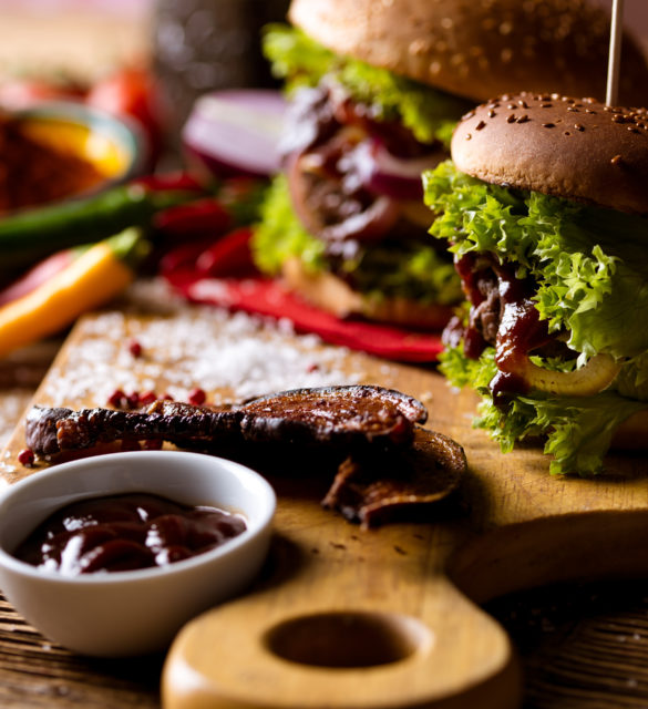 American burgers with spices, hot grilling meat American burgers with spices, hot grilling meat